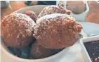  ??  ?? The mini doughnuts at Lazy Susan, 2378 S. Howell Ave., are served fresh, hot and with house-made jam.