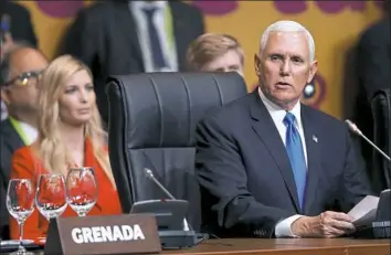  ?? Karel Navarro/Associated Press ?? Vice President Mike Pence speaks at the plenary session at the Summit of the Americas in Lima, Peru, on Saturday as Ivanka Trump, daughter of President Donald Trump, looks on.