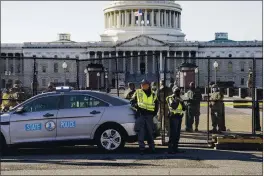  ?? AP PHOTO — JOHN MINCHILLO ?? Fencing is placed around the exterior of the Capitol grounds, Thursday morning, Jan. 7, 2021 in Washington.