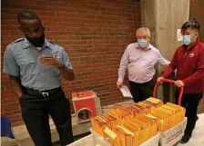  ?? STUaRT CahILL / hERaLD STaFF FILE ?? COUNT IS IN: Board of Election Commission­ers transport votes after counting them in City Hall on Sept. 15.