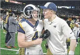  ?? Wally Skalij Los Angeles Times ?? GREG ZUERLEIN CELEBRATES with special-teams coach John Fassel after kicking a 57-yard field goal that sent the Rams to the Super Bowl.