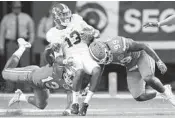  ?? JOHN BAZEMORE/AP ?? Alabama will face Washington in one semifinal. Alabama wide receiver ArDarius Stewart, at center, is shown here.