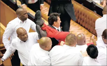  ?? PICTURE: SUMAYA HISHAM/REUTERS ?? Security officials remove EFF members during President Jacob Zuma’s State of the Nation Address in Cape Town last week.