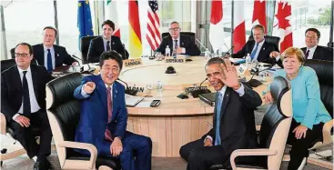  ??  ?? Working together: G7 leaders smiling for the camera at the start of the second working session of the summit meetings in Shima, Mie Prefecture, Japan.