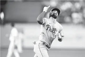  ?? KYUSUNG GONG AP ?? Philadelph­ia’s Bryce Harper homers Thursday vs. the Dodgers despite small ligament tear in his right elbow.