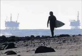  ?? Spencer Weiner Los Angeles Times ?? WITH DONALD TRUMP headed to the White House, California’s coast needs allies who will help prevent offshore drilling. Above, a surfer in Ventura County.