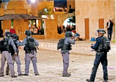  ?? Photo: AFP ?? Israeli security forces fire tear gas during clashes with Palestinia­n protesters at the Al-Aqsa mosque compound in Jerusalem.