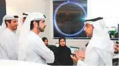  ??  ?? Shaikh Hamdan Bin Mohammad, Crown Prince of Dubai and Chairman of Mohammad Bin Rashid Space Centre, follows the first contact with KhalifaSat from earth station at MBRSC.