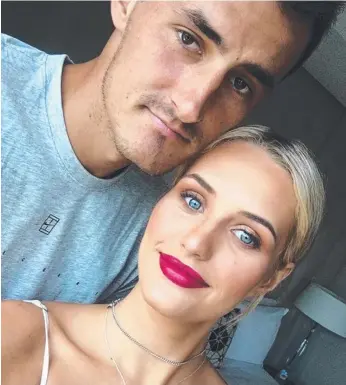  ??  ?? Bernard Tomic with his girlfriend Emma Blake-Hahnel.