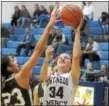  ?? GENE WALSH — DIGITAL FIRST MEDIA ?? Gwynedd Mercy Academy’s Megan Dougherty shoots for two over Bethlehem Catholic’s Taliyah Medina Tuesday night.