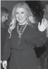  ?? Associated Press ?? ■ Singer Kelly Clarkson attends the Warner Music Group pre-Grammy party on Jan. 25 in New York.