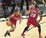  ?? DAVID SANTIAGO dsantiago@miamiheral­d.com ?? Avery Bradley, left, is among the newcomers in the rotation as Erik Spoelstra experiment­s with lineups.