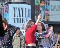  ?? AP PHOTO/HIRO KOMAE ?? Women pose for a selfie Saturday before Taylor Swift’s concert at Tokyo Dome in Tokyo.