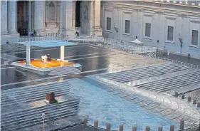  ?? Yara Nardi, AFP via Getty Images ?? Pope Francis prays at an empty St. Peter’s Square at the Vatican on March 27.