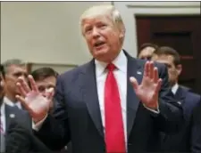  ?? PABLO MARTINEZ MONSIVAIS - THE ASSOCIATED PRESS ?? President Donald Trump gestures as he answers a question from a members of the media after signing an Executive Order in the Roosevelt Room of the White House in Washington, Friday. The Executive Order directs the Interior Department to begin review of...