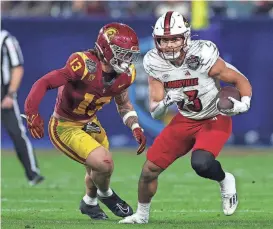  ?? SEAN M. HAFFEY /GETTY IMAGES ?? Isaac Guerendo rushed for 810 yards on 132 carries and caught 22 passes for 234 yards in his one season at Louisville.