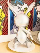  ??  ?? Artist Eric Doeringer, with his copies of Andy Warhol’s “Liz”; of Jeff Koons’s “Rabbit.”
