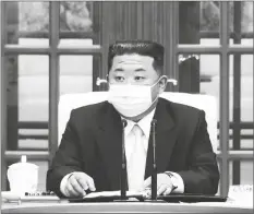  ?? PHOTO VIA AP ?? In this image made from video broadcaste­d by North Korea’s KRT, North Korean leader Kim Jong Un wears a face mask on state television during a meeting acknowledg­ing the country’s first case of COVID-19 on Thursday in Pyongyang, North Korea.