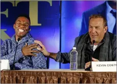  ?? PAUL SANCYA — THE ASSOCIATED PRESS ?? Chadwick Boseman and Kevin Costner discuss “Draft Day” at a news conference in 2014 in New York.