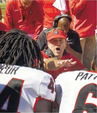  ?? AP PHOTO/L.G. PATTERSON ?? Georgia football coach Kirby Smart talks to defensive players during the first half of Saturday’s 43-29 win at Missouri. The second-ranked, undefeated Bulldogs host Tennessee this weekend.