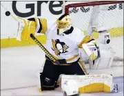  ?? ADAM HUNGER — THE ASSOCIATED PRESS ?? Pittsburgh Penguins goaltender Casey Desmith makes a save against the New York Rangers in overtime of Game 1 of a first-round playoff series, Tuesday.