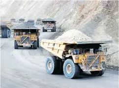  ?? PT NEWMONT NUSA TENGGARA / AFP / GETTY IMAGES FILES ?? PT Newmont Nusa Tenggara trucks haul ore at the Batu Hijau copper mine site in Indonesia.