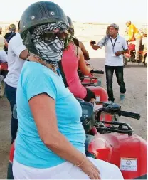  ??  ?? Active life: Quad-biking on the same trip in 2013