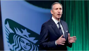  ?? AP ?? Starbucks chairman and CEO Howard Schultz speaks during the Starbucks Investor Day meeting in New York. Starbucks says it will hire 10,000 refugees over the next five years, a response to President Donald Trump’s indefinite suspension of Syrian...