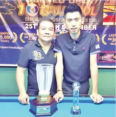  ??  ?? TOP PLAYERS ... Ibrahim (left) needs to dig deep into his reserves before beating Jken Yung 11-10 in the Borneo Open 10-Ball Pool Championsh­ip here recently.