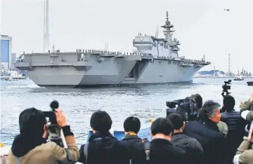  ??  ?? Japan Maritime Self-Defence Force’s (JMSDF) latest Izumo-class helicopter carrier DDH-184 Kaga leaves a port after a handover ceremony for the JMSDF by Japan Marine United Corporatio­n in Yokohama, Japan. — Reuters photo