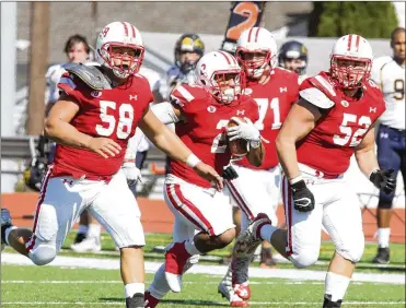  ??  ?? Wittenberg running back DeShawn Sarley (2) runs behind a solid wall of blockers for a touchdown Saturday.