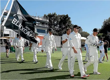  ?? PHOTOSPORT ?? The Black Caps step out on to Seddon Park for the start of the first test against Bangladesh where a series victory – which would be their fifth in a row – would confirm their status as the second-best test team in the world.