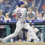  ?? Mitchell Leff / Getty images ?? Steven Matz of the Mets hits a solo home run in the top of the third inning against the Phillies at Citizens Bank Park on Tuesday in Philadelph­ia.