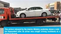  ??  ?? This picture released by the Interior Ministry yesterday shows a vehicle impounded after its driver was caught driving recklessly at a street in Kuwait.