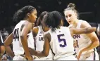  ?? Stephen Dunn / Associated Press ?? UConn’s Crystal Dangerfiel­d (5) gets her team into a huddle during the second half against California on Sunday in Storrs.