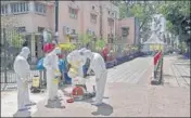  ??  ?? Health workers prepare to sanitise the area to curb the spread of Covid-19 at Nizamuddin in New Delhi on Wednesday. BIPLOV BHUYAN/HT