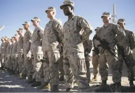  ?? Massoud Hossaini / Associated Press 2018 ?? U.S. Marines observe a change of command ceremony in January 2018 at the Shorab military camp in Afghanista­n’s southern Helmand province.