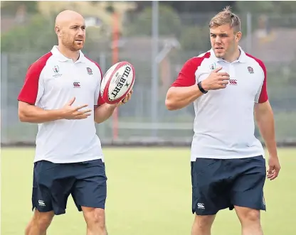  ?? Picture: PA. ?? England’s Willi Heinz, left, and Jack Singleton during a training session ahead of tomorrow’s game against Wales in Cardiff.