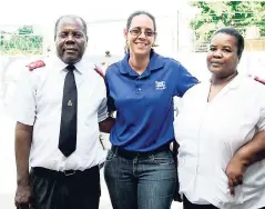  ??  ?? Annakaye Tucker (centre), trade marketing manager, IGL Ltd, is flanked by administra­tors at The Nest Children’s Home, Major Jean Hubert Murat, and his wife Major Magalie Murat, at the Christmas treat for the Nest Children’s Home, Mannings Hill Road.