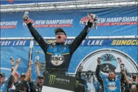  ?? MARY SCHWALM — ASSOCIATED PRESS ?? Kevin Harvick celebrates in Victory Lane after winning the Monster Energy Cup Series race July 22 at New Hampshire Motor Speedway in Loudon, N.H.