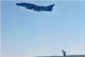  ??  ?? A Syrian aircraft takes off from the al-Shayrat airfield to bomb rebel-held areas in an act of defiance just hours after the US military strike on the base