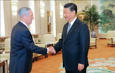  ?? LI GANG / XINHUA ?? President Xi Jinping meets with United States Secretary of Defense James Mattis at the Great Hall of the People in Beijing on Wednesday. Xi said China will stick to peaceful developmen­t in the process of building a modernized socialist country.