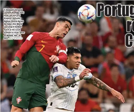  ?? AFP PHOTO ?? Portugal’s forward Cristiano Ronaldo (left) heads the ball past Uruguay’s defender Mathias Olivera during the Qatar 2022 World Cup Group H football match at the Lusail Stadium in Lusail, Qatar on Monday, Nov. 28, 2022.