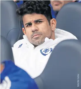  ??  ?? Chelsea’s Diego Costa sits on the bench during the match against Tottenham.