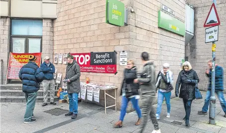  ?? Brown. Picture: Steven ?? Protesters urging an end to benefit sanctions outside the under-fire JobCentre Plus in the Wellgate Shopping Centre, Dundee.