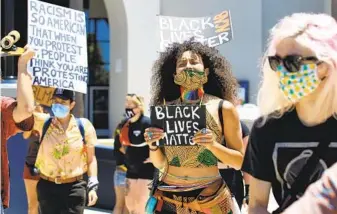  ?? BILL WECHTER ?? About 100 people gathered in downtown Oceanside Saturday for a Black Lives Matter protest.