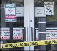  ?? MATTHEW DAE SMITH — LANSING STATE JOURNAL VIA AP ?? Pictured is the scene where a 77-year-old man was stabbed by a 43-year-old man Tuesday morning outside of a Quality Dairy on Lansing Road in Windsor Township, Mich. A Grand Ledge man who stabbed an elderly man outside a Quality Dairy store after being refused service for not wearing a mask was shot and killed by an Eaton County deputy several miles away, Michigan State Police said.