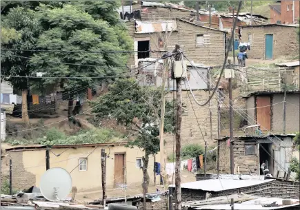  ?? PICTURE: SIBONELO NGCOBO ?? A spider’s web of electricit­y connection­s seen during an inspection of the Sanathan informal settlement in Umzinto on the South Coast yesterday.