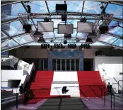  ?? DANIEL COLE - THE ASSOCIATED PRESS ?? Crew members install the red carpet at the Palais des Festivals ahead of the opening day of the 75th internatio­nal film festival, Cannes, southern France, Tuesday. The Cannes film festival runs from May 17 until May 28.