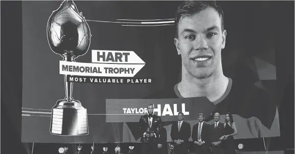  ?? ETHAN MILLER/GETTY IMAGES ?? Taylor Hall accepts the Hart Trophy Wednesday during the NHL awards in Las Vegas. The league’s MVP notched 93 points with the New Jersey Devils in 2017-18.